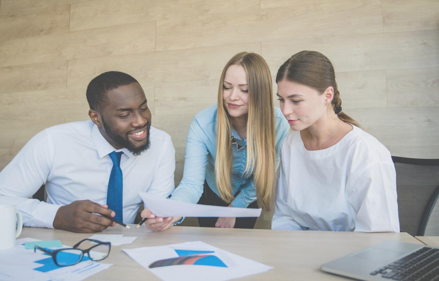Financial analyst reviewing detailed modeling outputs and documentation